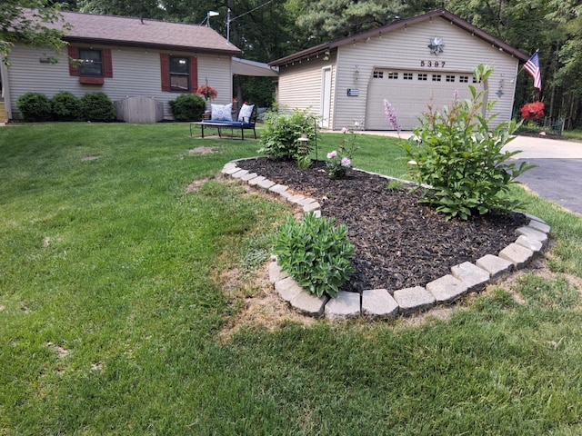5397 E 80th St, Newaygo, MI 49337 - view of green lawn with a garage