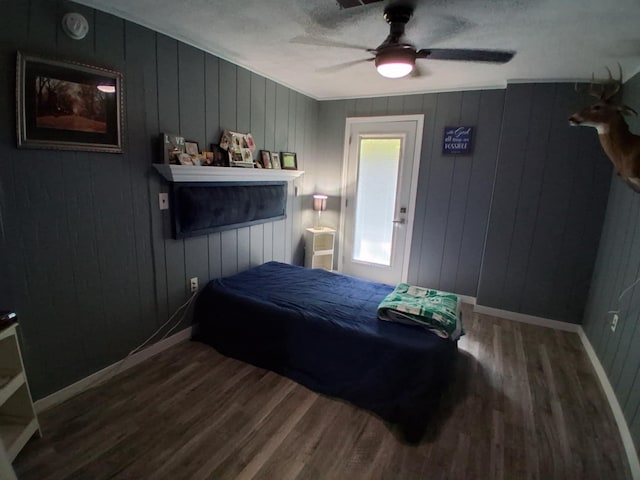 5397 E 80th St, Newaygo, MI 49337 - bedroom with wood finished floors, wood walls, and a ceiling fan
