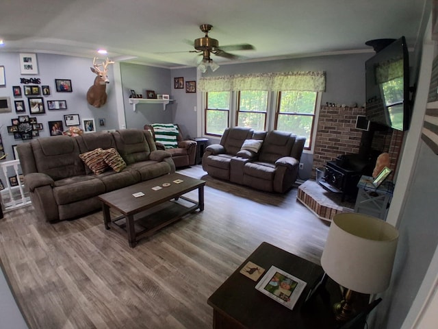 5397 E 80th St, Newaygo, MI 49337 - living room with a wood stove, ceiling fan, and wood finished floors