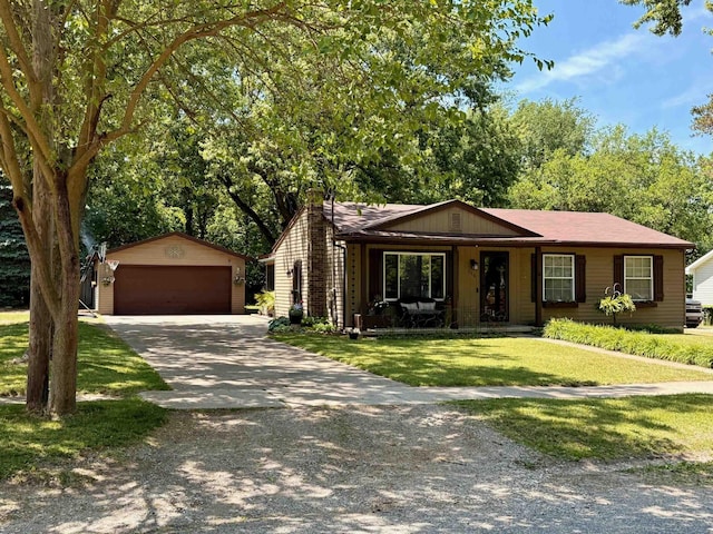 316 Colfax St, Fenton, MI 48430 - single story home featuring an outdoor structure, a front lawn, and a garage