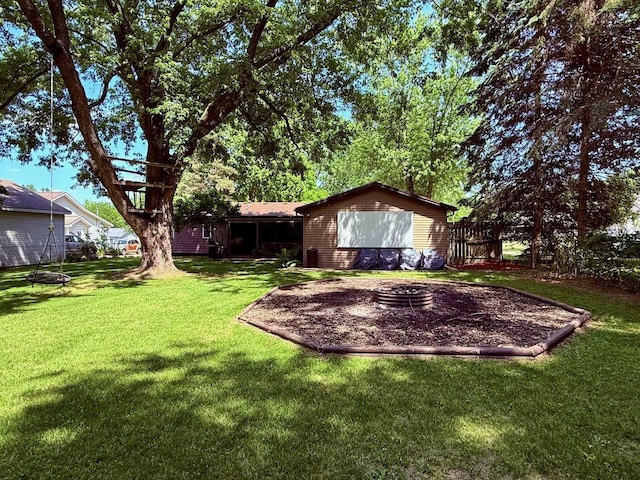 316 Colfax St, Fenton, MI 48430 - view of green lawn featuring a fire pit