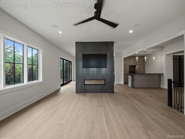 1120 Lyonhurst St, Birmingham, MI 48009 - unfurnished living room with a ceiling fan, a large fireplace, light wood finished floors, and recessed lighting