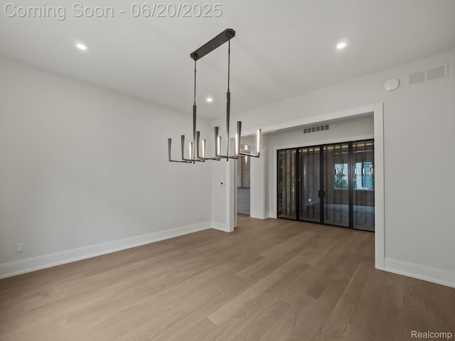 1120 Lyonhurst St, Birmingham, MI 48009 - unfurnished room with wood finished floors, recessed lighting, and a chandelier