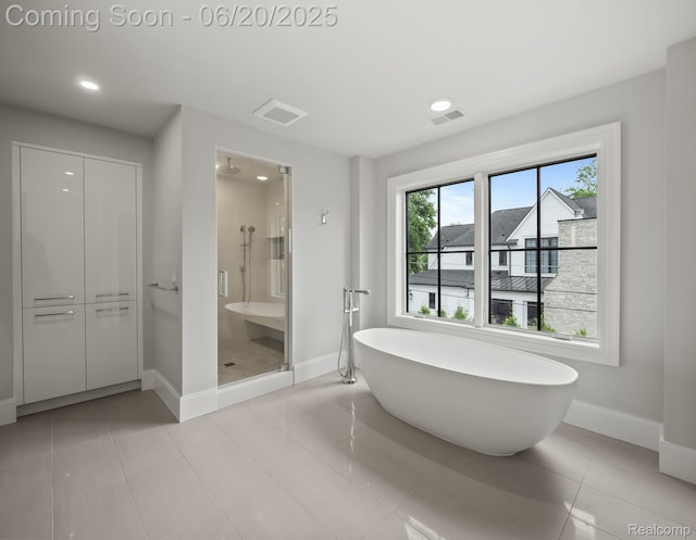 1120 Lyonhurst St, Birmingham, MI 48009 - full bathroom featuring a shower stall, a soaking tub, recessed lighting, and tile patterned flooring