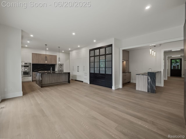 1120 Lyonhurst St, Birmingham, MI 48009 - unfurnished living room with recessed lighting and light wood-type flooring