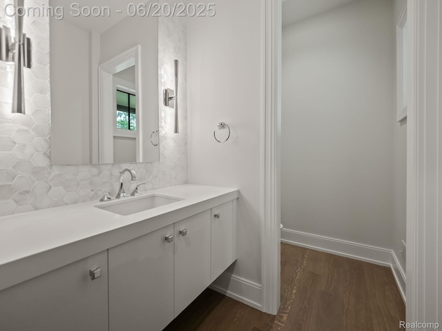 1120 Lyonhurst St, Birmingham, MI 48009 - bathroom featuring wood finished floors, backsplash, and vanity