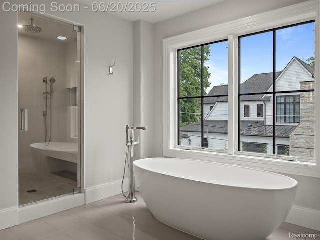 1120 Lyonhurst St, Birmingham, MI 48009 - full bathroom featuring a shower stall, tile patterned flooring, and a freestanding tub