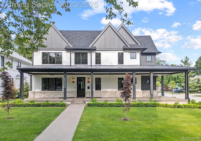1120 Lyonhurst St, Birmingham, MI 48009 - view of front of house featuring a standing seam roof, covered porch, a shingled roof, and a front yard