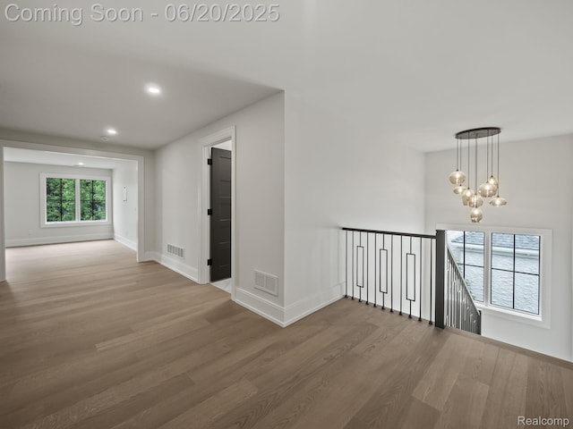 1120 Lyonhurst St, Birmingham, MI 48009 - empty room with wood finished floors, a chandelier, and recessed lighting