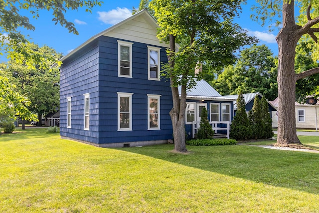 922 Marion Ave, Big Rapids, MI 49307 - view of front of property with a front yard and crawl space