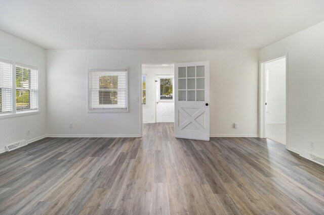 922 Marion Ave, Big Rapids, MI 49307 - unfurnished room with wood finished floors and baseboards