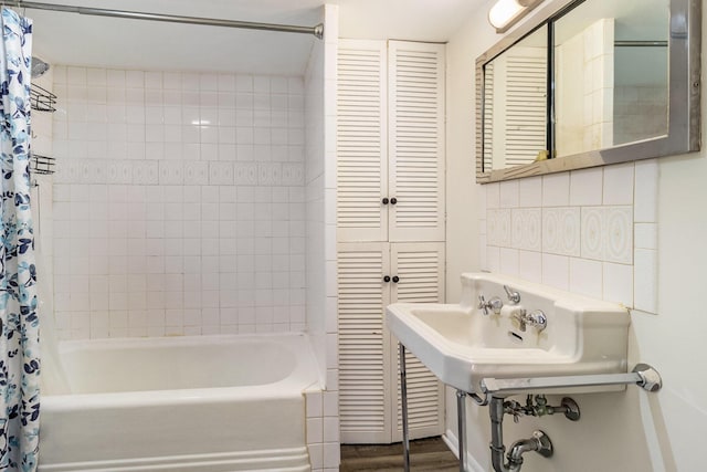 922 Marion Ave, Big Rapids, MI 49307 - bathroom with a closet, shower / bath combo, and wood finished floors