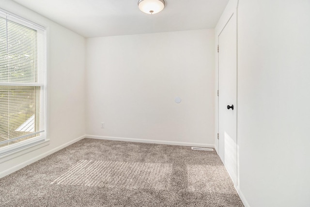 922 Marion Ave, Big Rapids, MI 49307 - carpeted spare room featuring baseboards