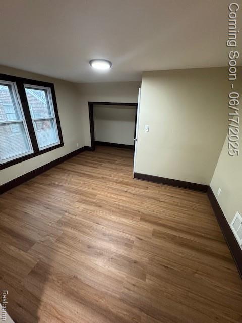 5215 Buckingham Ave, Detroit, MI 48224 - empty room with light wood-style floors