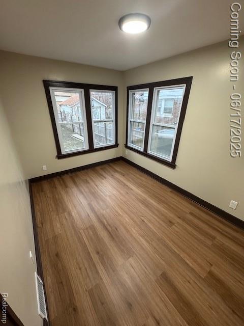 5215 Buckingham Ave, Detroit, MI 48224 - empty room with wood finished floors