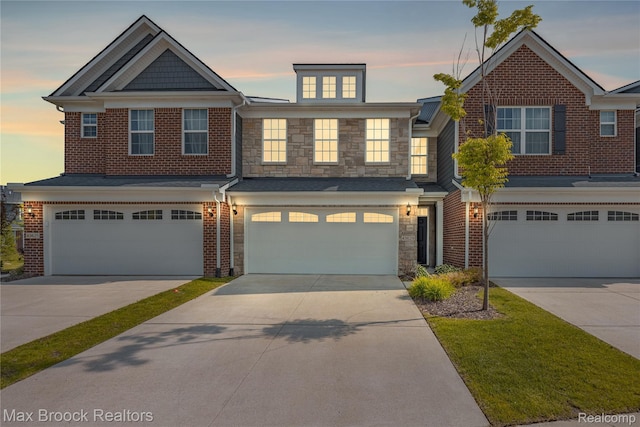 43629 Prospect Unit 102, Novi, MI 48375 - townhome / multi-family property with a garage, stone siding, and driveway