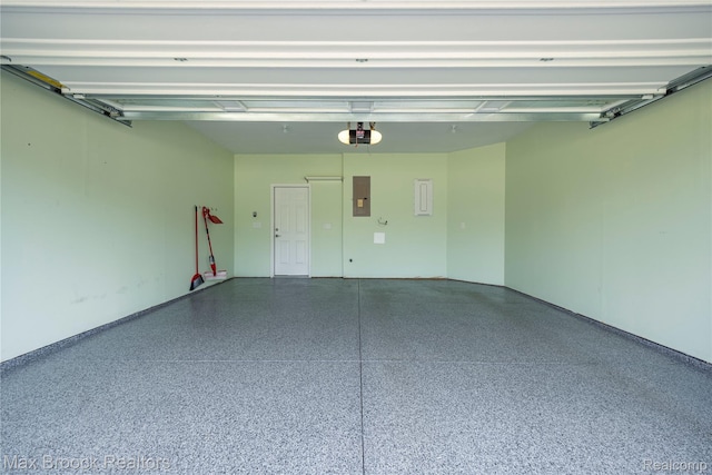 43629 Prospect Unit 102, Novi, MI 48375 - garage with electric panel and a garage door opener