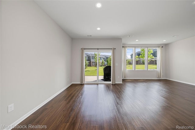 43629 Prospect Unit 102, Novi, MI 48375 - spare room featuring dark wood finished floors and recessed lighting