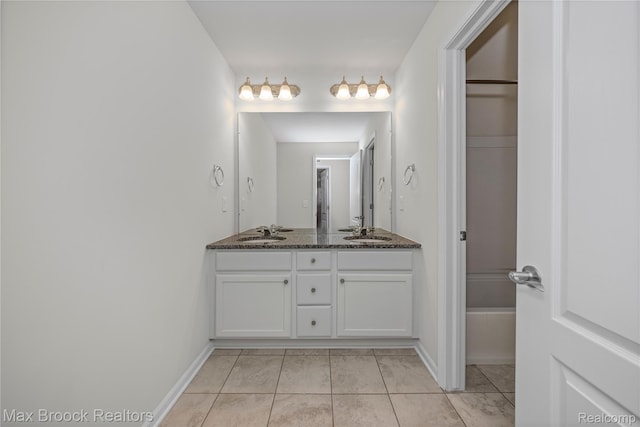43629 Prospect Unit 102, Novi, MI 48375 - bathroom with double vanity and tile patterned flooring