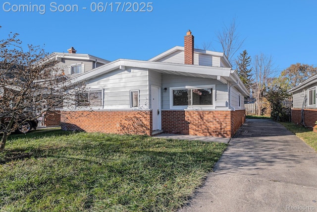 408 W Jarvis Ave, Hazel Park, MI 48030 - view of front of home with brick siding and a chimney