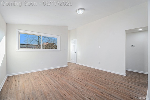 408 W Jarvis Ave, Hazel Park, MI 48030 - unfurnished room with wood finished floors and lofted ceiling