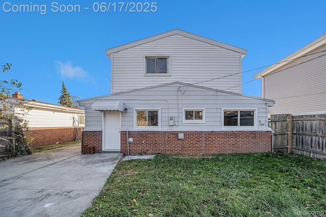408 W Jarvis Ave, Hazel Park, MI 48030 - rear view of property with brick siding and a patio area