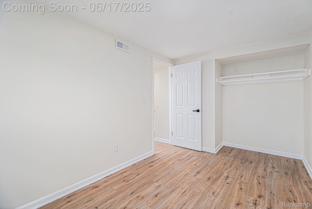 408 W Jarvis Ave, Hazel Park, MI 48030 - unfurnished bedroom with light wood-type flooring and a closet