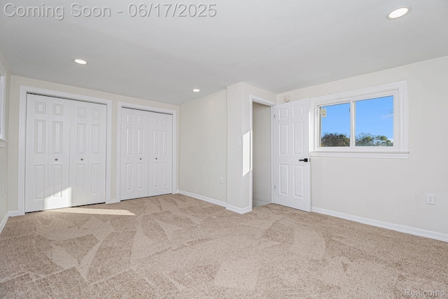 408 W Jarvis Ave, Hazel Park, MI 48030 - unfurnished bedroom featuring carpet flooring, two closets, and recessed lighting