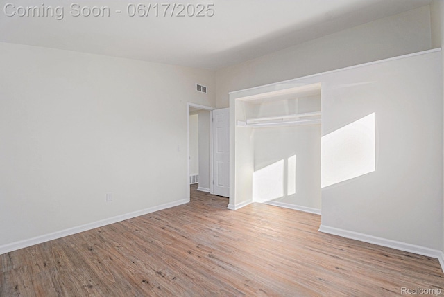 408 W Jarvis Ave, Hazel Park, MI 48030 - unfurnished bedroom featuring wood finished floors and a closet