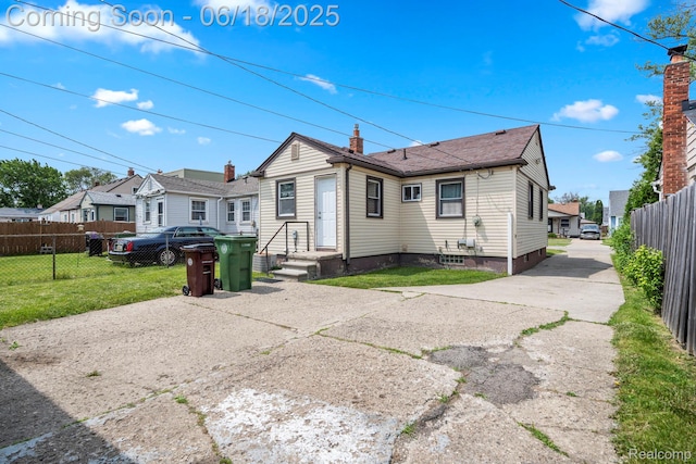 12925 Castle St, Southgate, MI 48195 - rear view of house with a chimney
