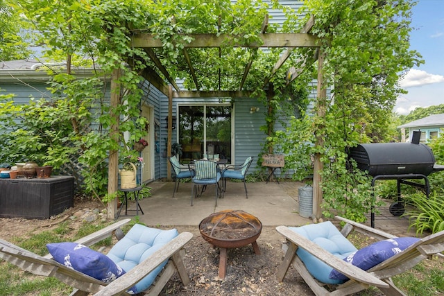 857 Kalamazoo St, South Haven, MI 49090 - view of patio / terrace featuring a fire pit, a pergola, and outdoor dining area