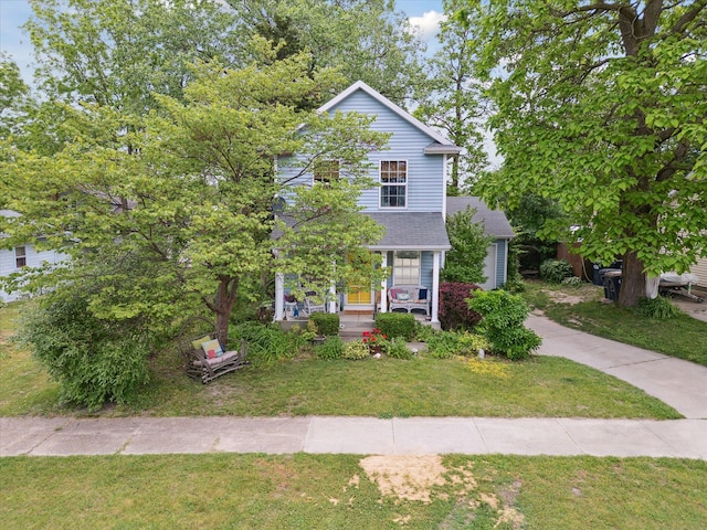 857 Kalamazoo St, South Haven, MI 49090 - view of front of property featuring a front lawn and a porch