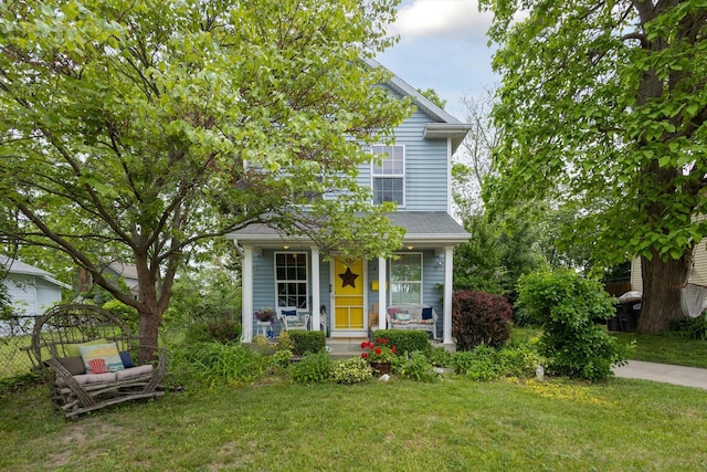 857 Kalamazoo St, South Haven, MI 49090 - view of front of home featuring a front lawn and a porch