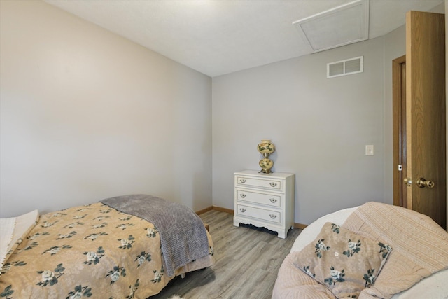 857 Kalamazoo St, South Haven, MI 49090 - bedroom featuring light wood finished floors and attic access