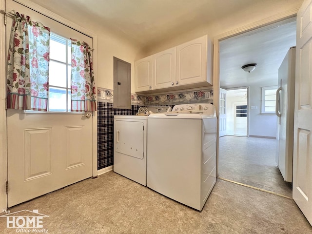 435 Brandon St, Owosso, MI 48867 - laundry area with cabinet space, electric panel, washing machine and clothes dryer, a wainscoted wall, and light flooring