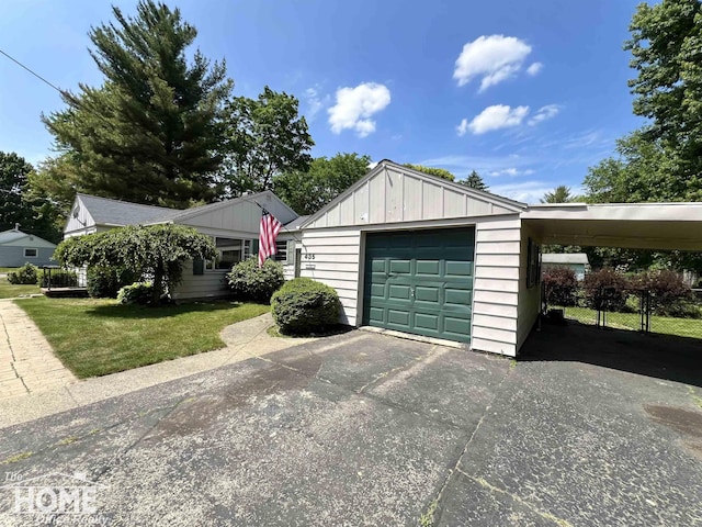 435 Brandon St, Owosso, MI 48867 - garage featuring asphalt driveway