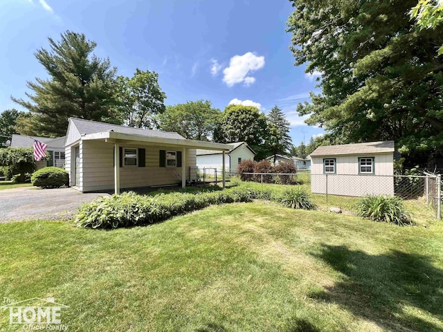 435 Brandon St, Owosso, MI 48867 - view of yard with asphalt driveway and a garage