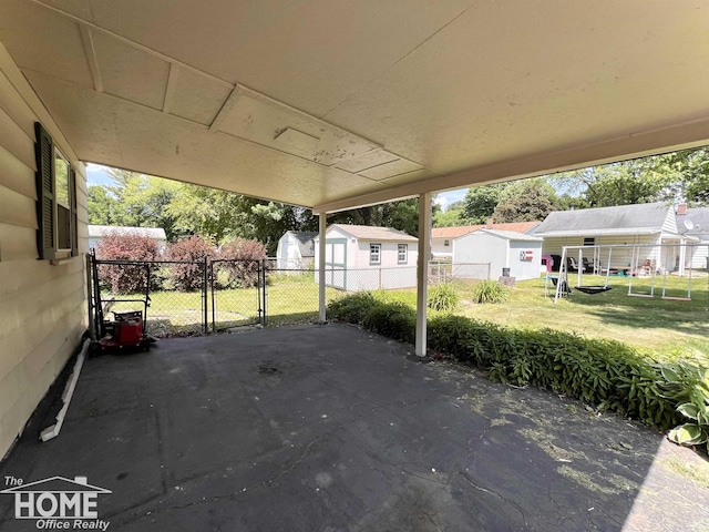 435 Brandon St, Owosso, MI 48867 - view of patio / terrace with a storage shed and a residential view