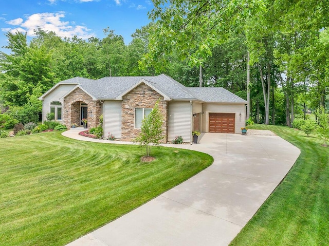 6143 Pheasant Ct, Berrien Springs, MI 49103 - view of front of home with stone siding, concrete driveway, a garage, and a front lawn