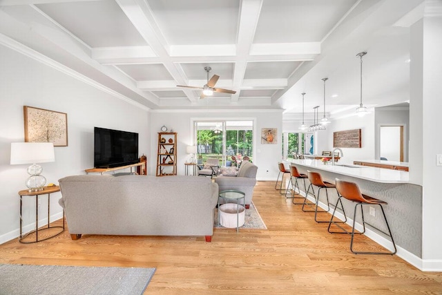 6143 Pheasant Ct, Berrien Springs, MI 49103 - living room featuring ceiling fan, beamed ceiling, coffered ceiling, light wood-style flooring, and crown molding