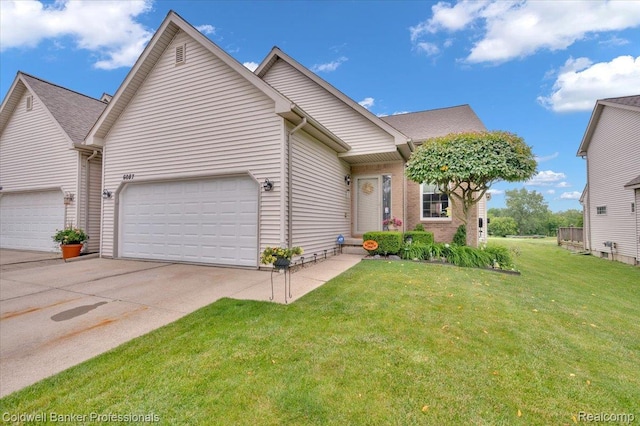 6087 Davison Rd, Byron, MI 48509 - view of front of home featuring concrete driveway, a garage, and a front yard