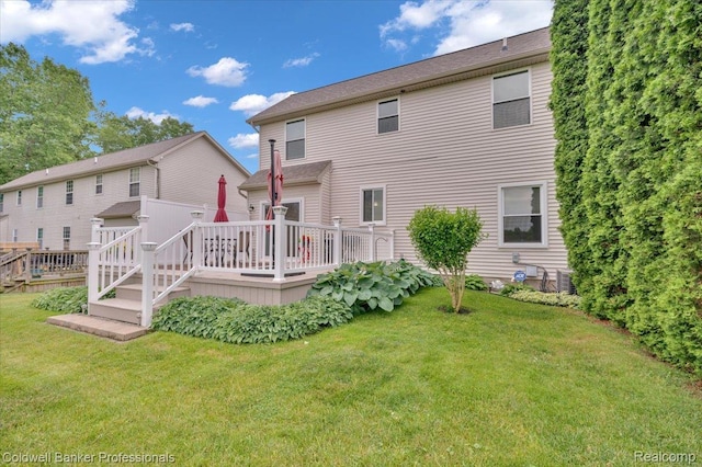 6087 Davison Rd, Byron, MI 48509 - back of property featuring a wooden deck and a yard
