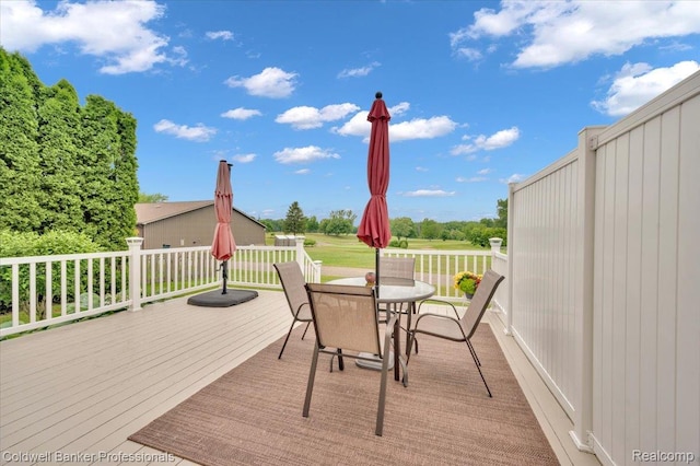 6087 Davison Rd, Byron, MI 48509 - wooden terrace with outdoor dining space