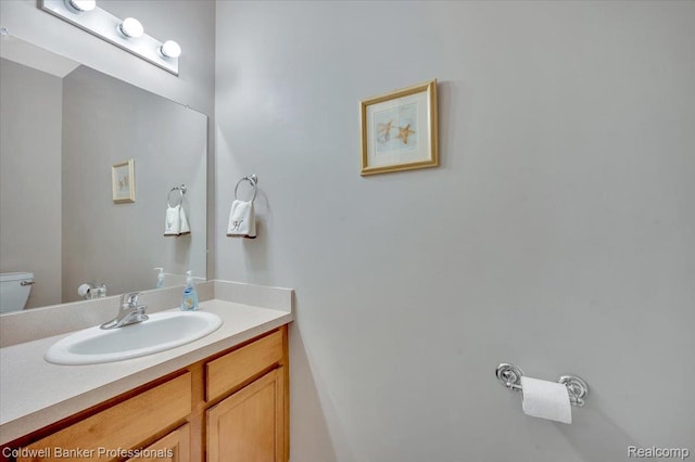 6087 Davison Rd, Byron, MI 48509 - bathroom featuring toilet and vanity