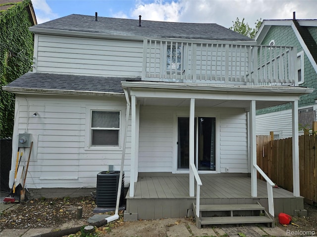 4294 W Buena Vista St, Detroit, MI 48238 - rear view of house with a deck and roof with shingles