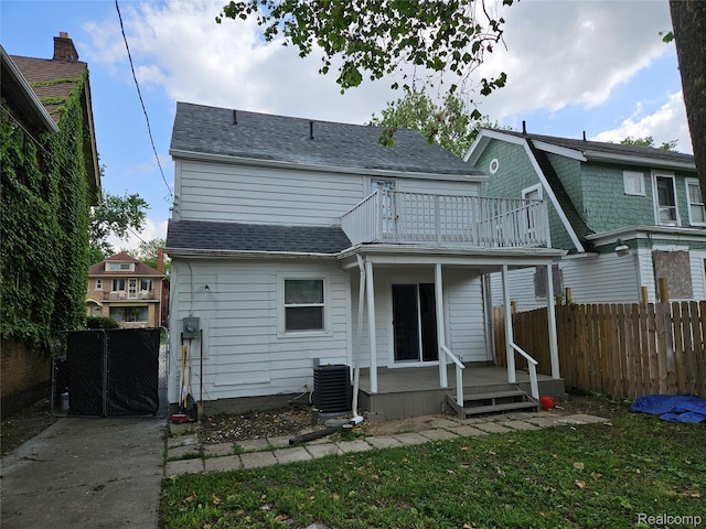 4294 W Buena Vista St, Detroit, MI 48238 - back of house featuring a balcony, roof with shingles, and a wooden deck