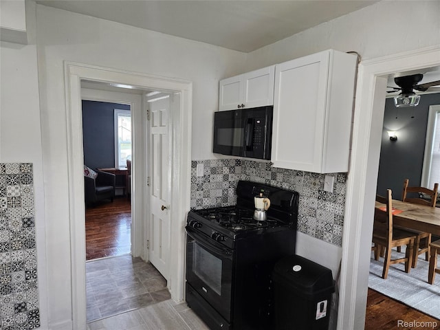 4294 W Buena Vista St, Detroit, MI 48238 - kitchen with black appliances, white cabinets, backsplash, ceiling fan, and light countertops