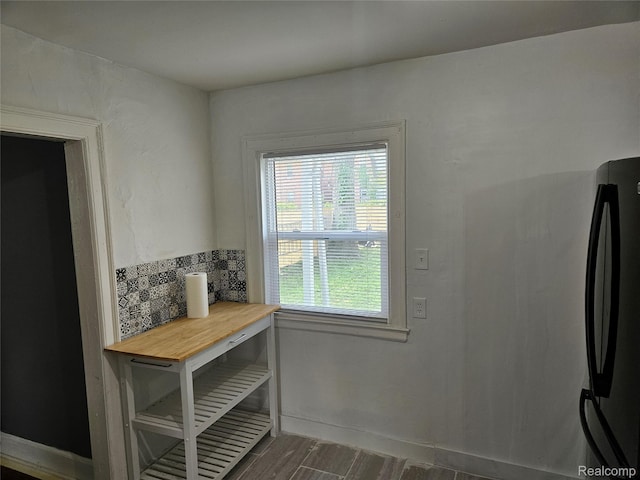 4294 W Buena Vista St, Detroit, MI 48238 - unfurnished dining area featuring dark wood-style floors and baseboards