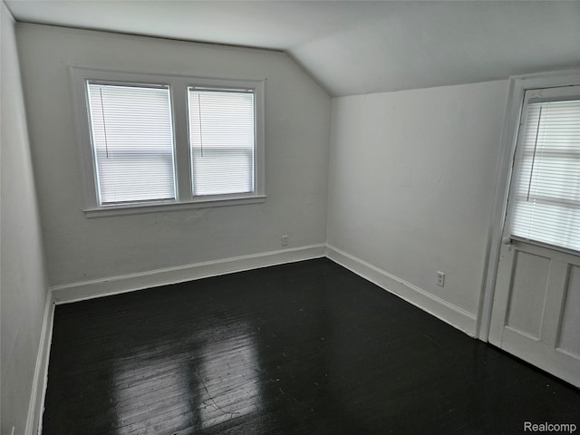 4294 W Buena Vista St, Detroit, MI 48238 - bonus room with vaulted ceiling and dark wood-type flooring