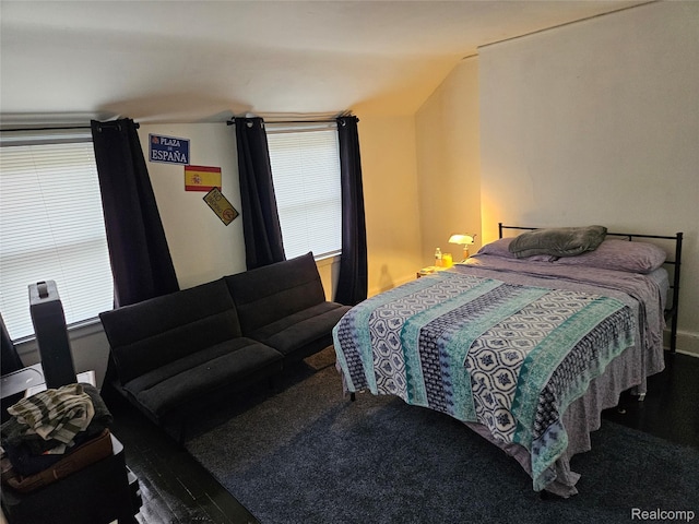 4294 W Buena Vista St, Detroit, MI 48238 - bedroom featuring vaulted ceiling, multiple windows, and carpet